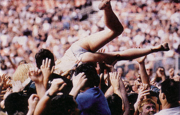 Naked crowd surfing